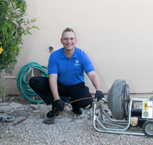 All Masters Plumbing technician clearing drain clog